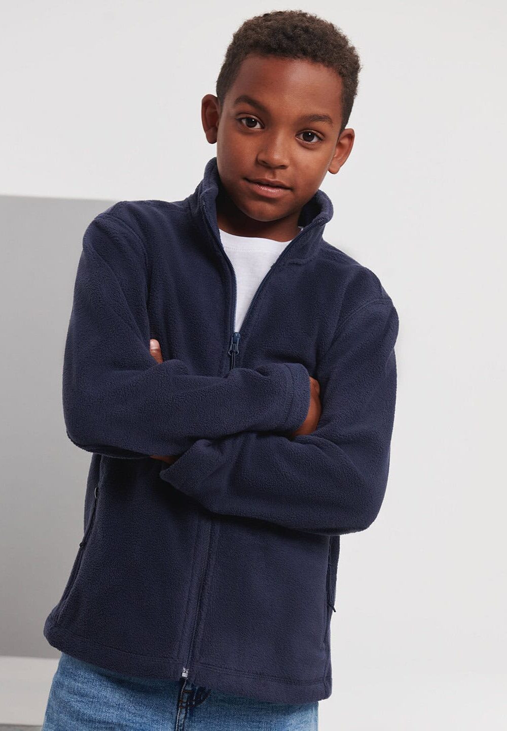 Soft navy fleece jacket for children, ideal for personalised workwear and school uniform embroidery.