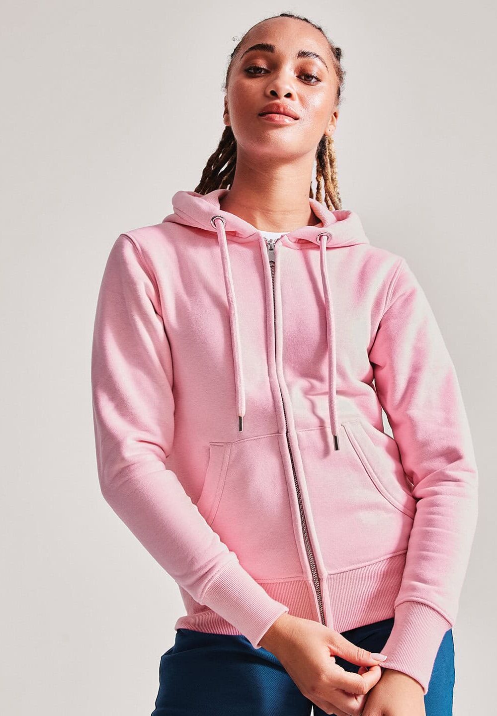Bright pink zip-up hoodie with adjustable drawstrings and front pockets, perfect for customised embroidered workwear and personalised uniforms, offering a stylish and comfortable look.