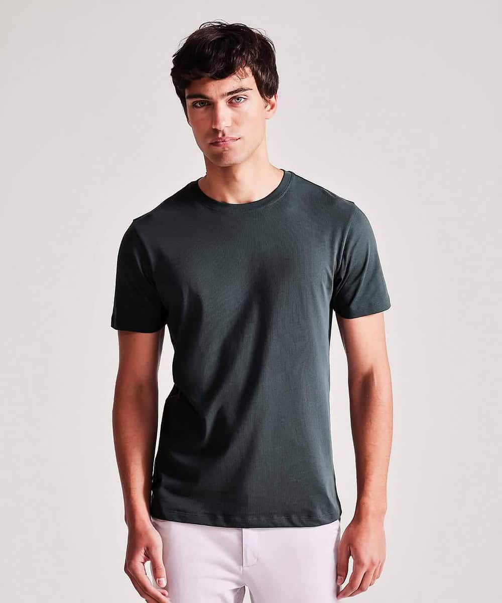 Man wearing a plain black T-shirt, ideal for teamwear and workwear uniforms.