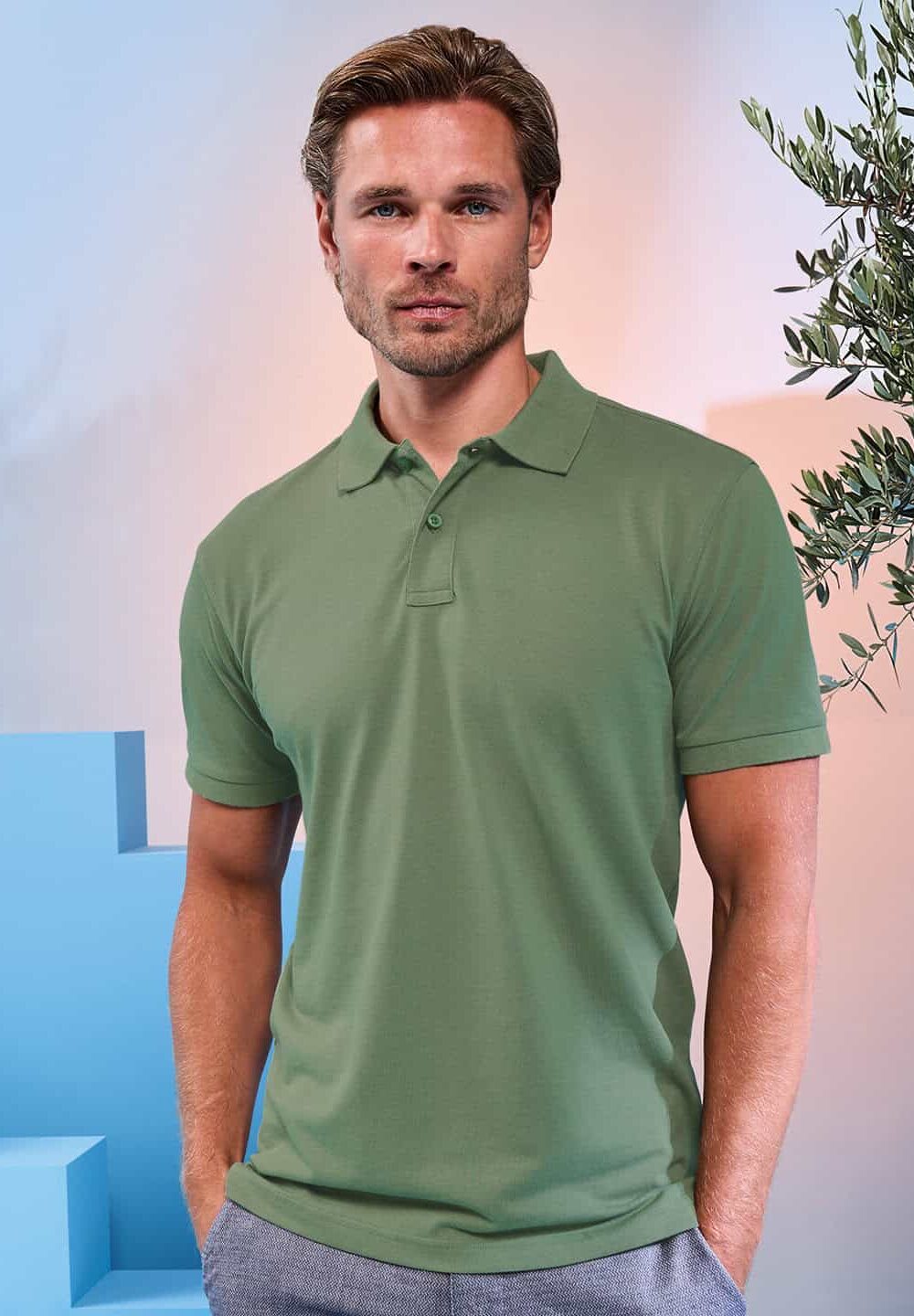 Men's green polo shirt ideal for workwear and personalised uniforms, perfect for embroidery and branding, comfortable and professional for vibrant corporate or hospitality uniforms.