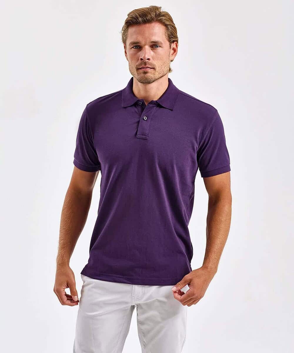 Man wearing a purple polycotton blend polo shirt, front view.