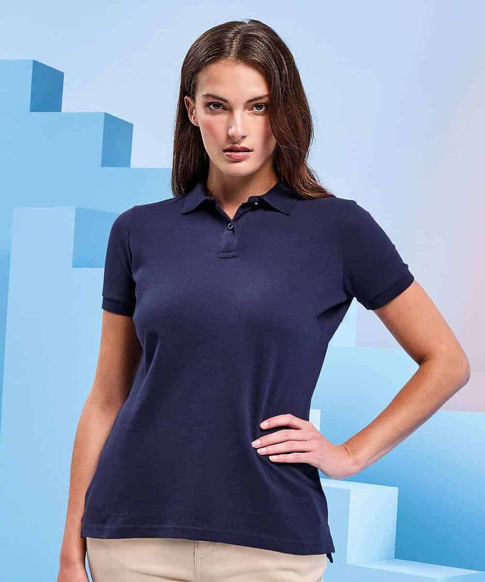 Woman wearing navy blue polo shirt, suitable for workwear uniforms.