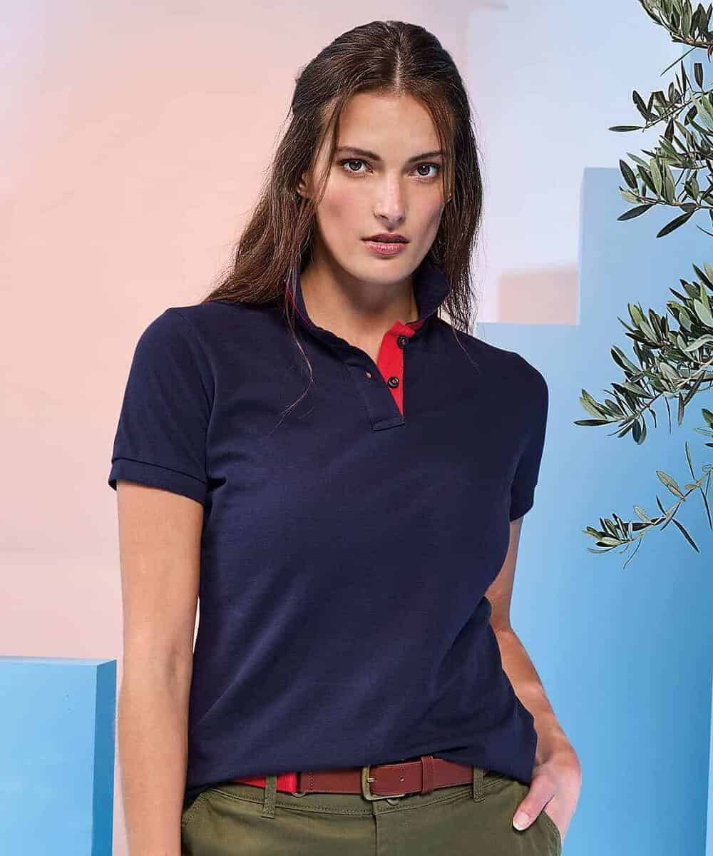 Woman wearing navy blue contrast polo shirt, suitable for work and team uniforms.