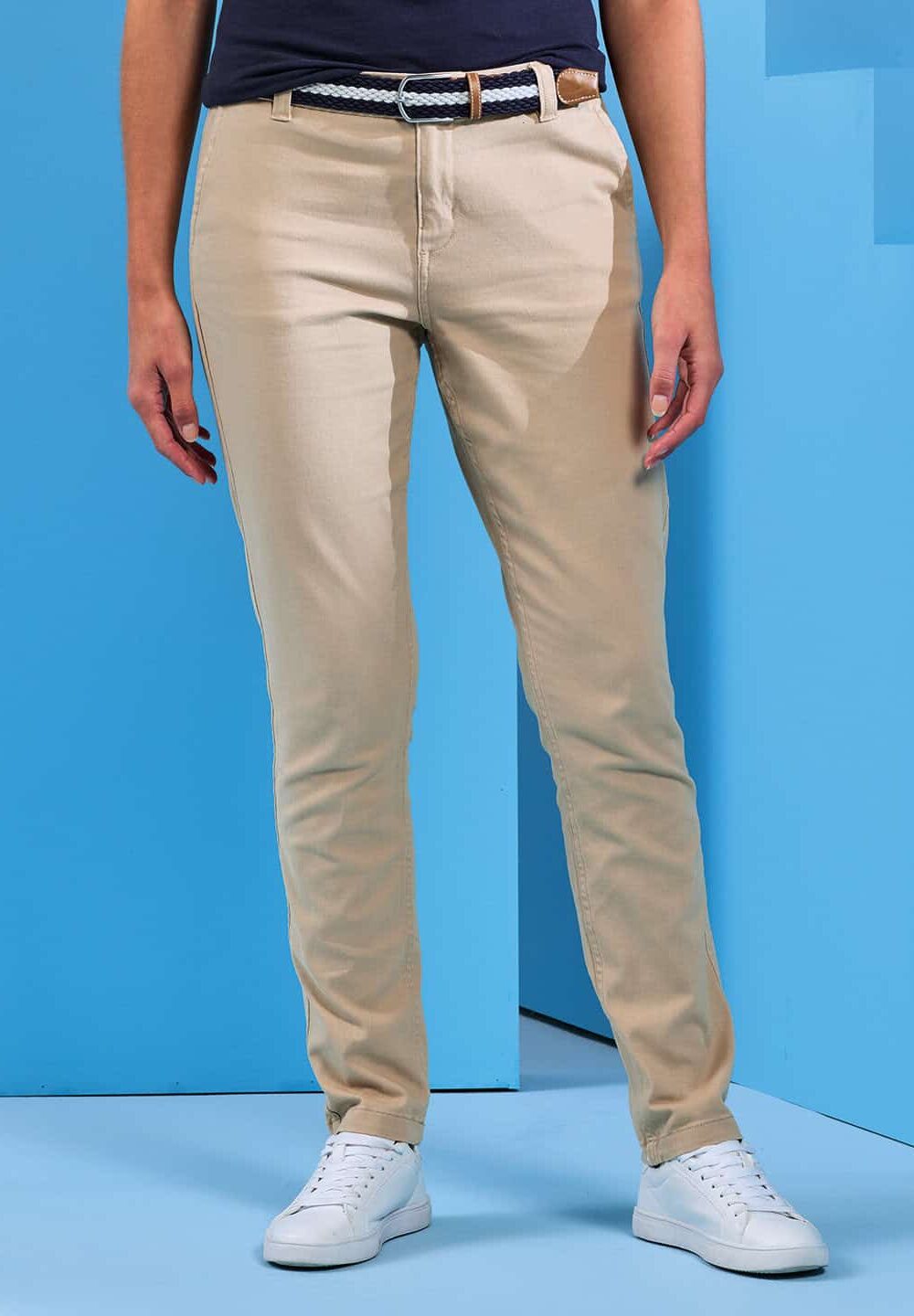 Beige workwear trousers with navy belt and white sneakers, suitable for personalised embroidery and employee uniforms. Perfect for professional and corporate workwear needs.