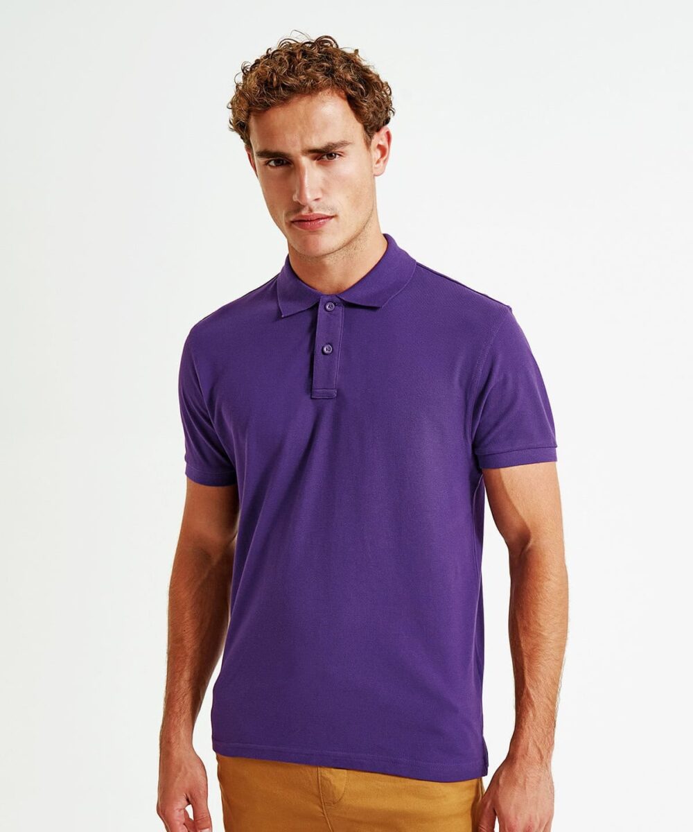 Man wearing a purple organic polo shirt, suitable for work or casual settings.