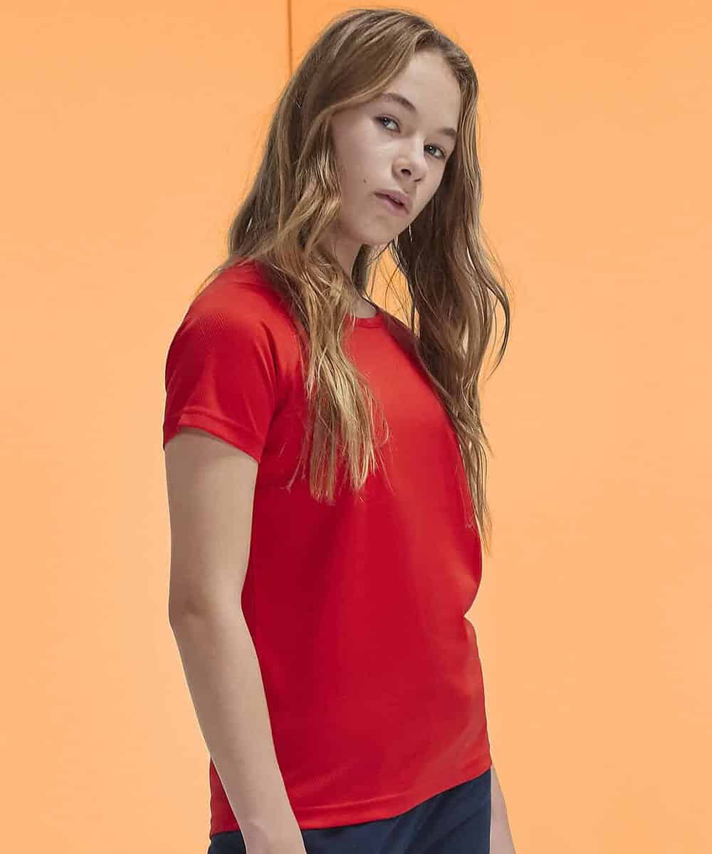 Bright red B&C Active T/Kids worn by a young girl on a peach background.