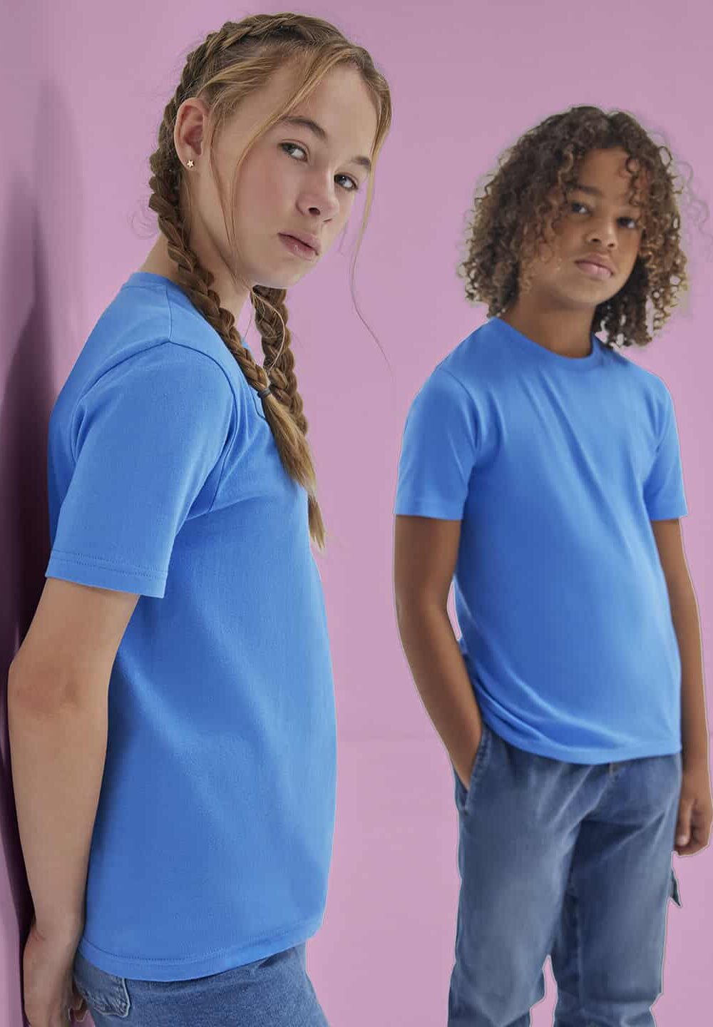 Bright blue personalised workwear T-shirts with embroidery, ideal for school uniforms and professional embroidery branding, displayed against a pastel pink background for promotional purposes.