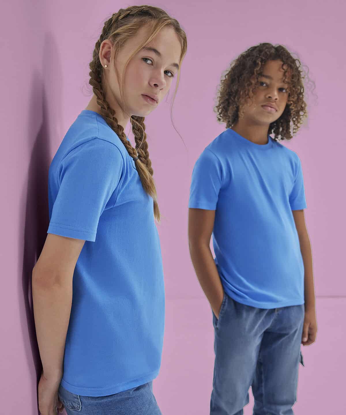 Bright blue personalised workwear T-shirts with embroidery, ideal for school uniforms and professional embroidery branding, displayed against a pastel pink background for promotional purposes.
