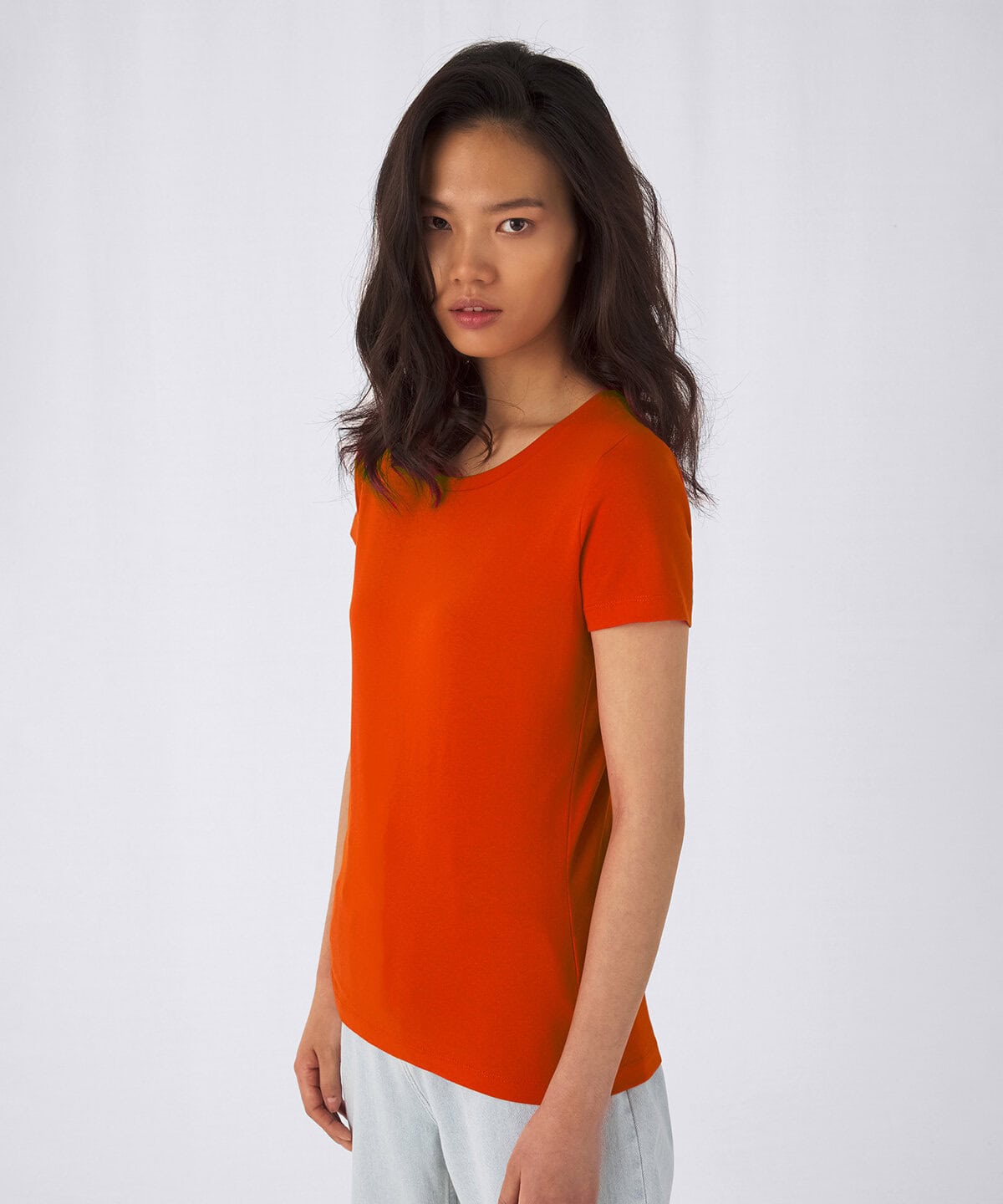 Vibrant orange women's T-shirt, perfect for customised embroidery workwear and personalised uniforms, made from comfortable, high-quality fabric.