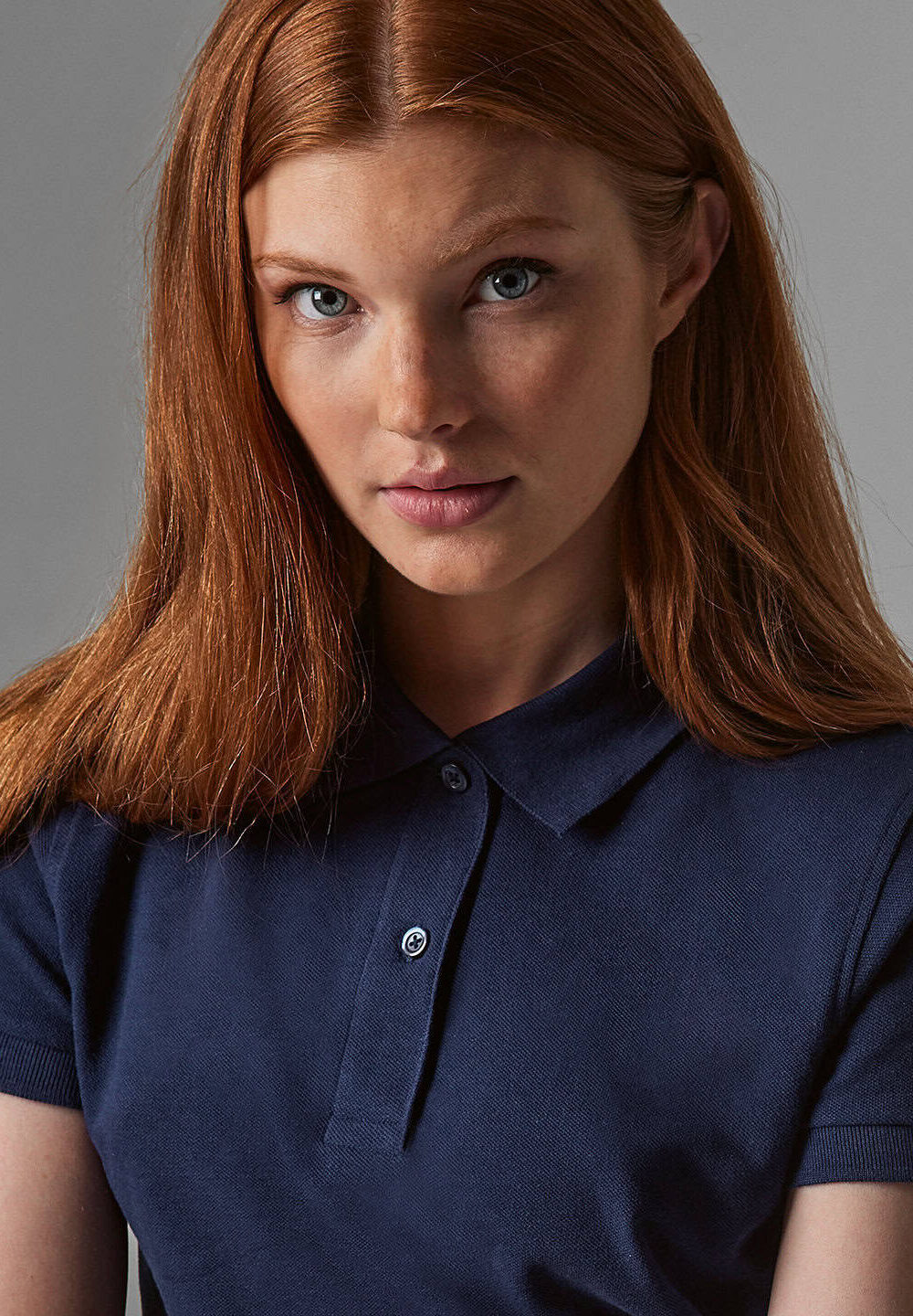 High-quality navy polo shirt with embroidered logo, ideal for workwear and personalised uniforms, showcasing professional embroidered workwear solutions for businesses.
