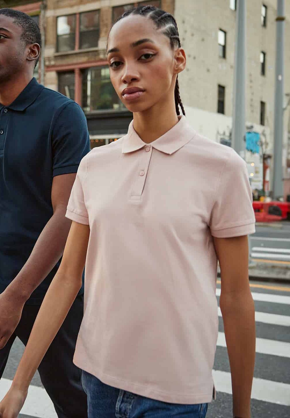 Soft pink embroidered polo shirt for workwear and personalised uniforms, ideal for professional embroidery or printing, making it suitable for various industries and branding needs.