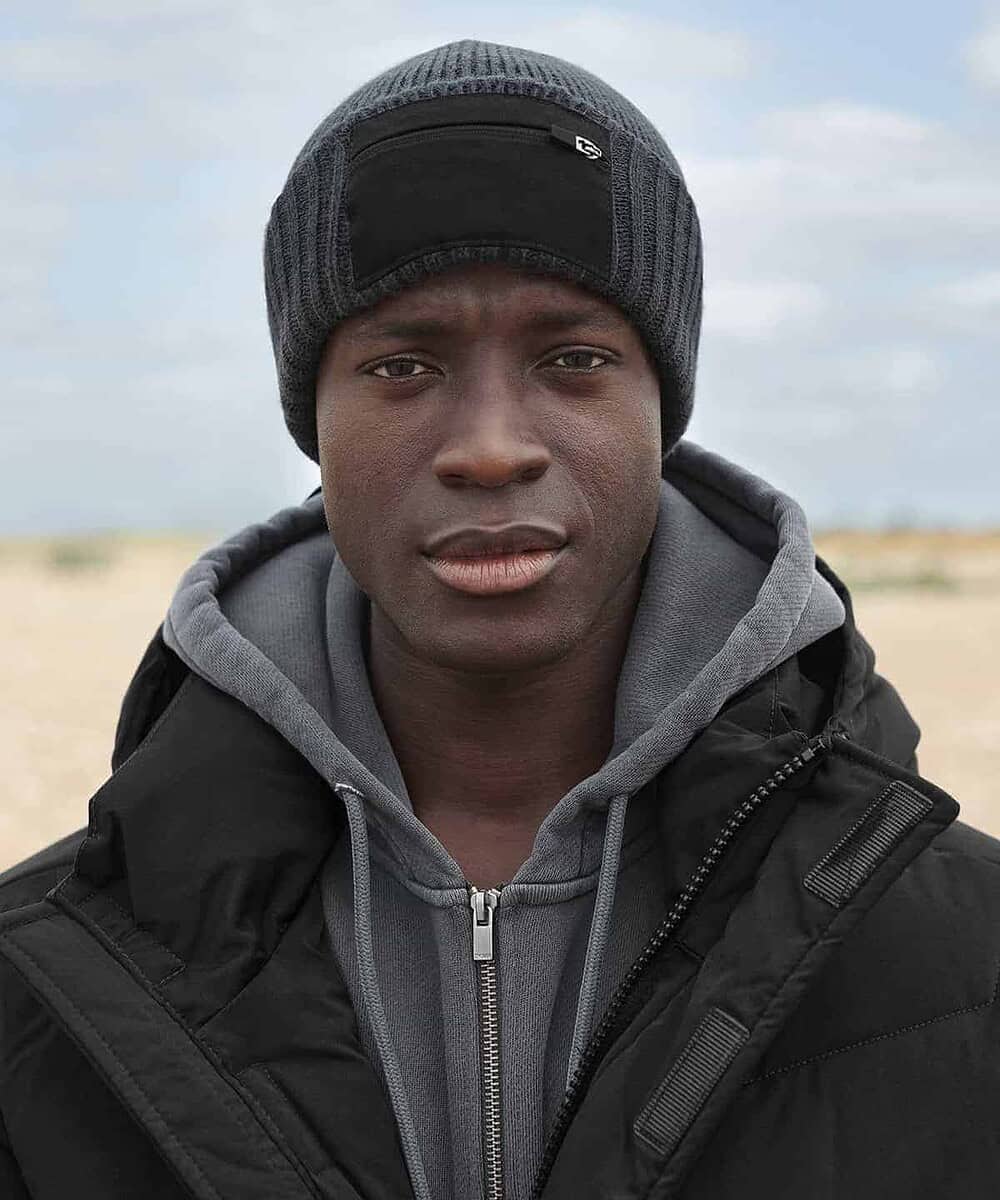 Embroidered Beechfield B334R zip patch beanie on a man outdoors. Perfect for custom branding or pers.