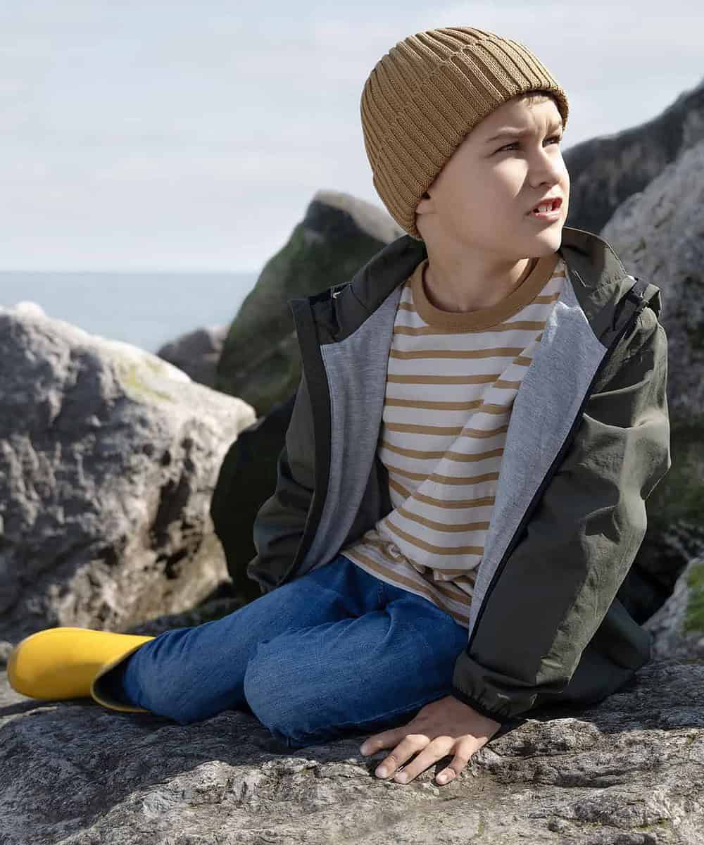 Child wearing a Beechfield B341B organic cotton beanie outdoors.