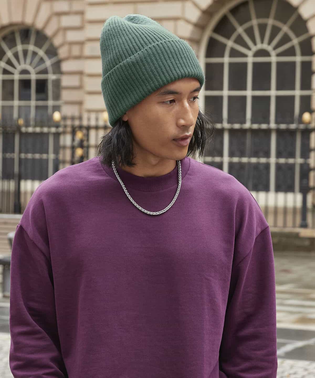 Brightly coloured embroidered workwear in urban outdoor setting, showcasing custom personalisation for different industries, ideal for corporate, hospitality, and trade uniforms.