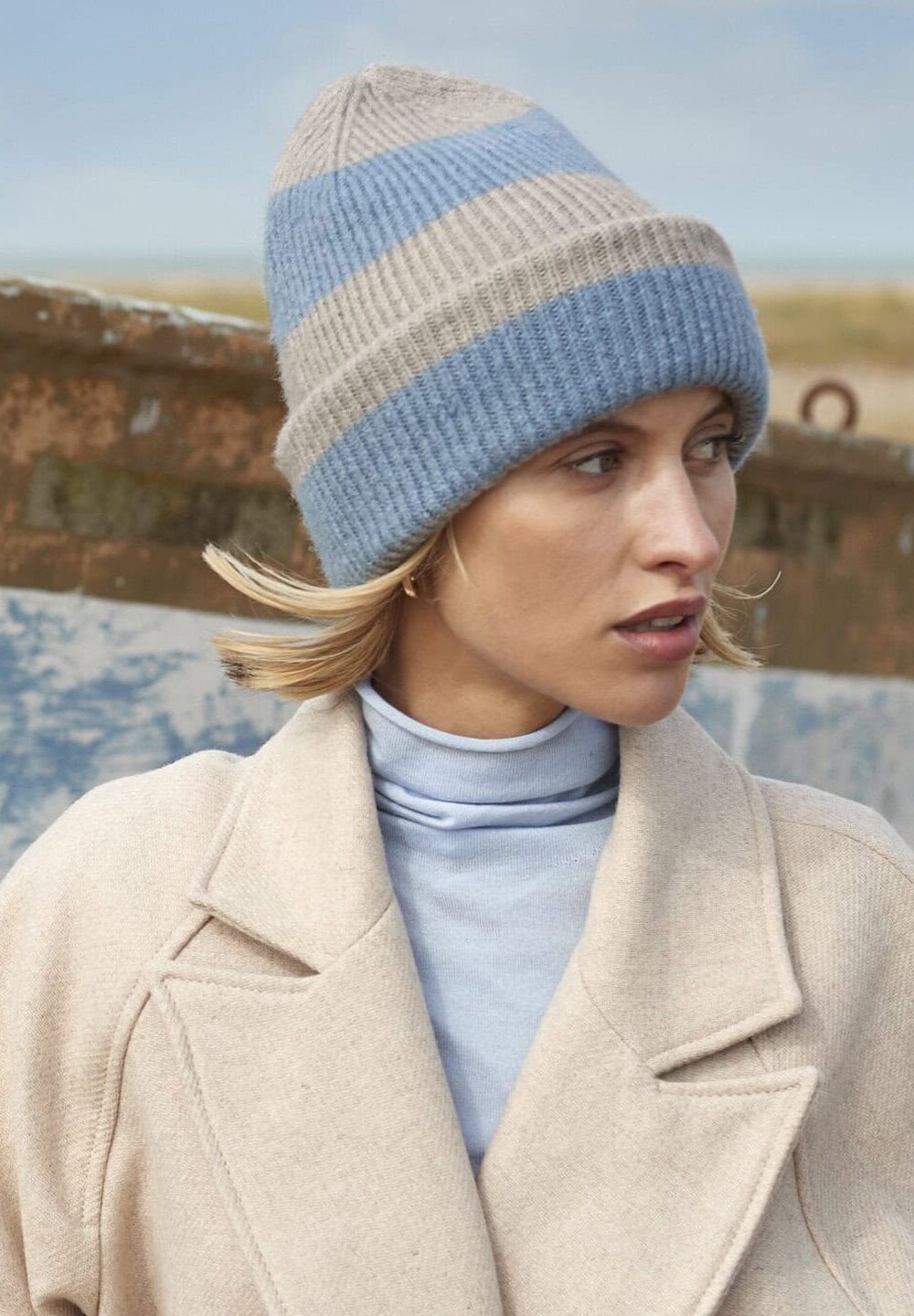 Bright blue and grey striped knitted beanie hat, suitable for personalised embroidery and workwear, ideal for cold weather, casual or promotional uniforms.