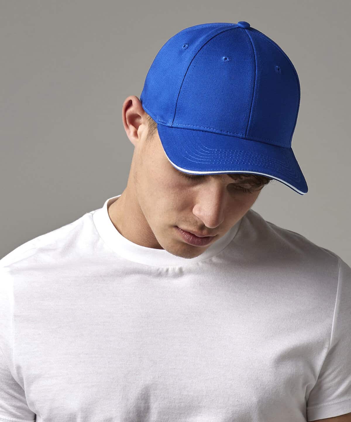 Blue embroidered workwear cap with personalised logo for company uniforms.