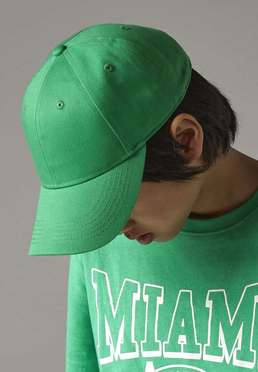 Bright green baseball cap with embroidered logo, casual promotional workwear accessory.
