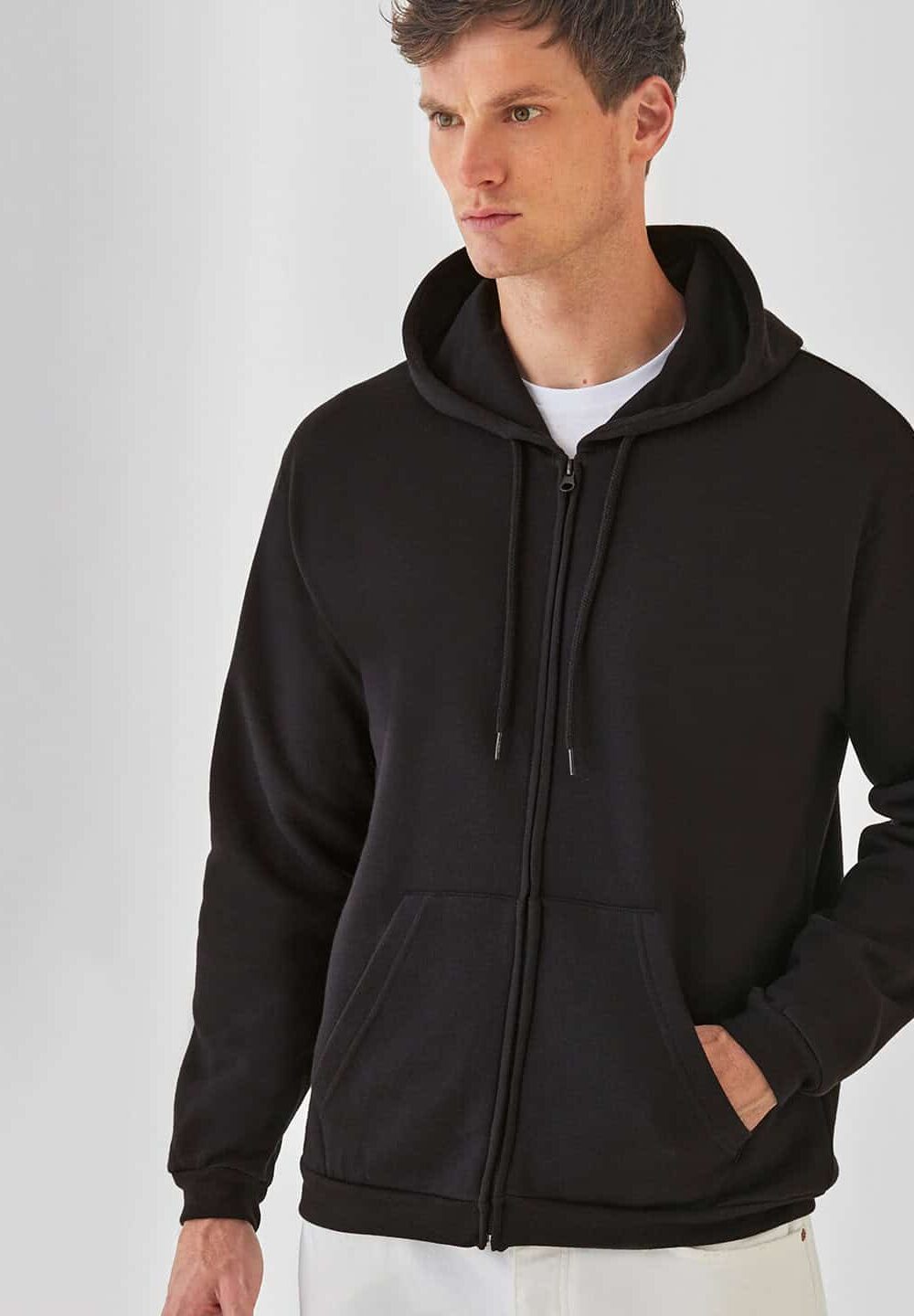 Black zip-up hoodie, comfortable casual wear with a drawstring hood and front pockets, ideal for custom embroidery and personalised workwear, perfect for promotional clothing.