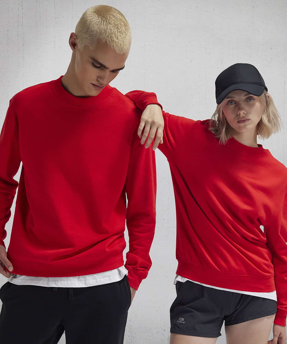 Bright red embroidered workwear sweatshirts for personalised uniforms and corporate branding.