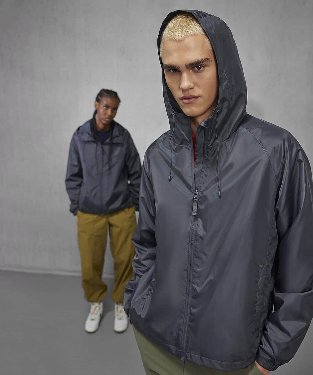 Modern grey windbreaker jacket with hood, ideal for work and outdoor activities.