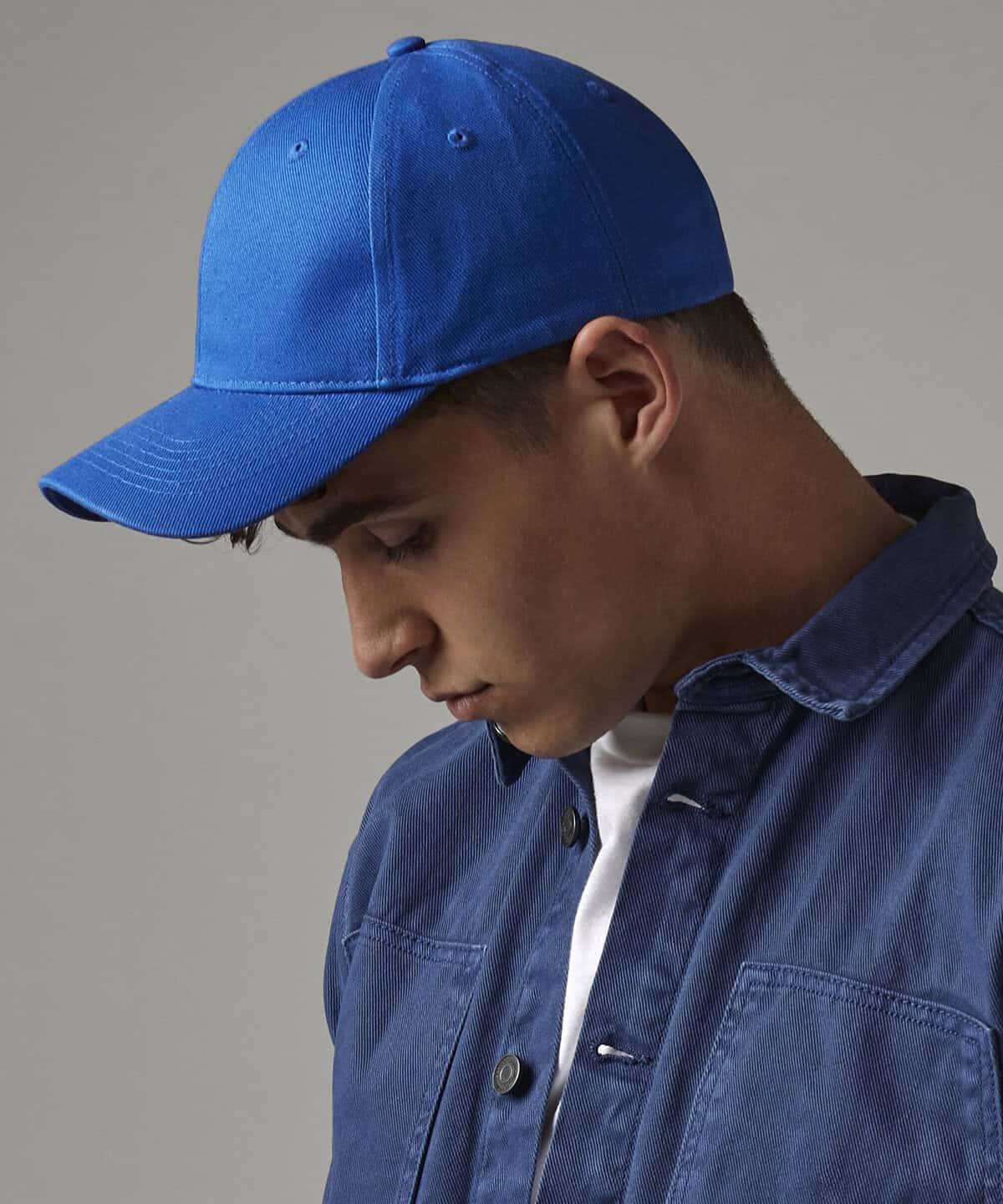 Blue baseball cap with embroidery detail for workwear and personalised uniforms.