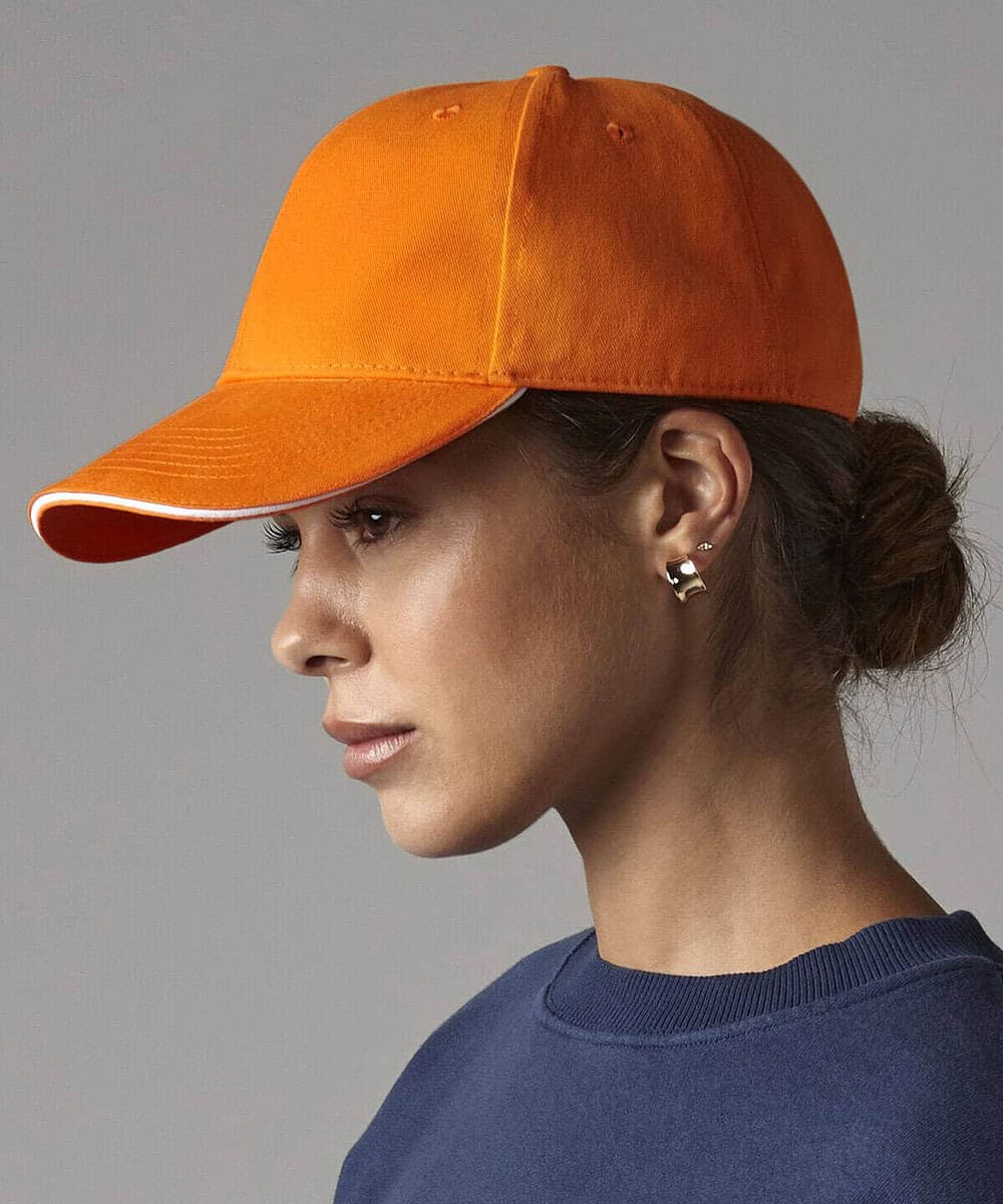 Orange Beechfield BC020 six-panel athleisure cap for custom embroidery.