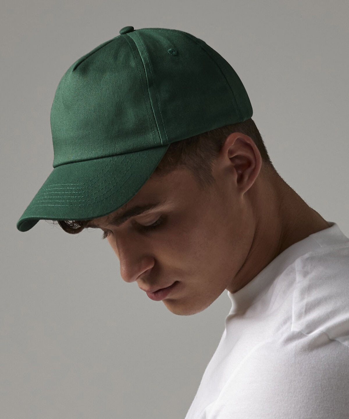 Green embroidered workwear cap for personalised uniforms and company branding.