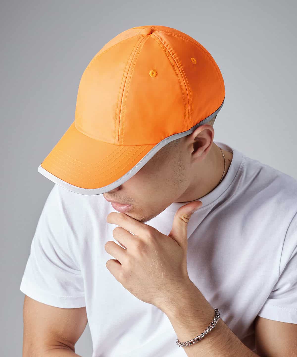 Reflective orange work cap with grey trim for safety and durability.