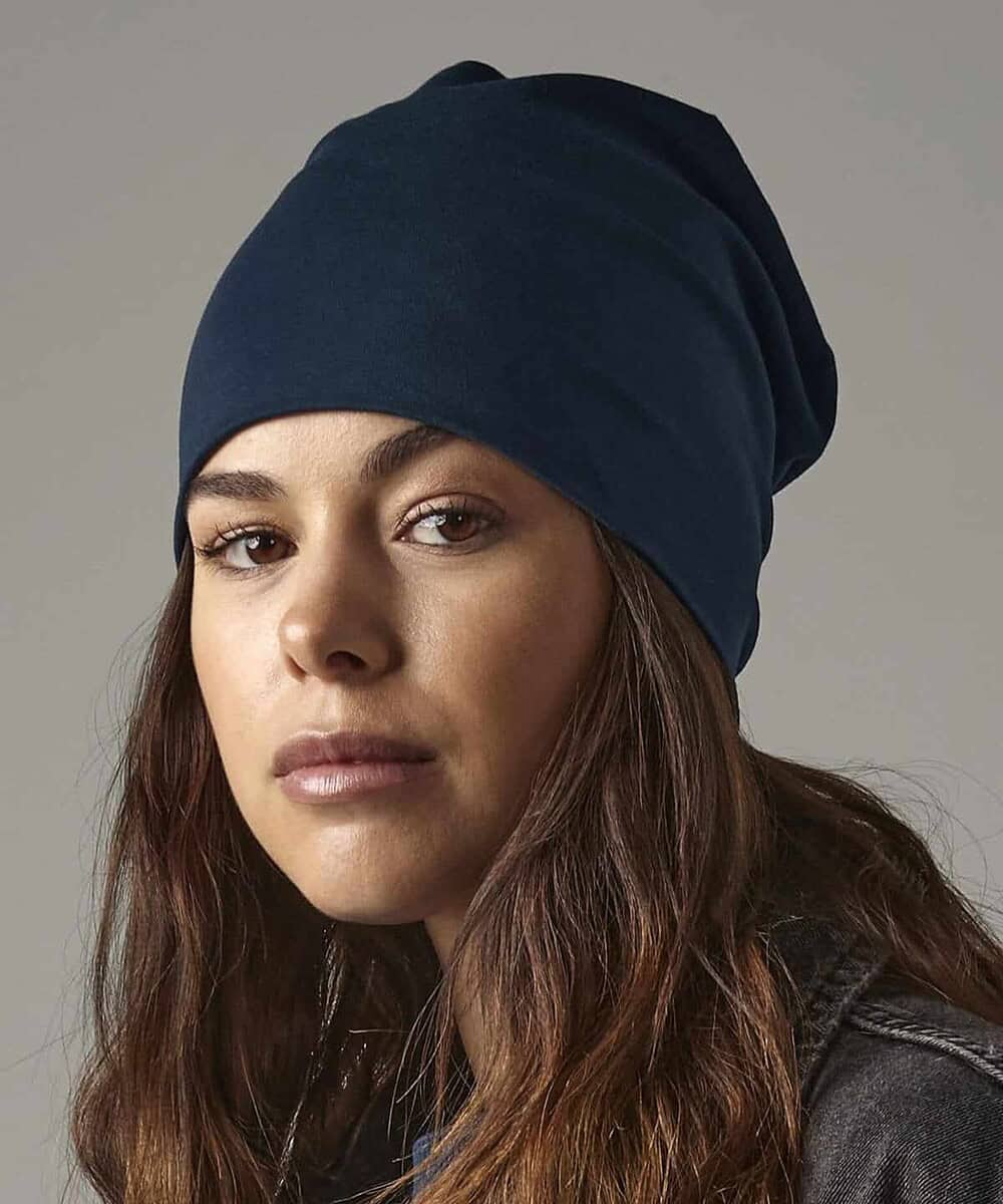 Cotton slouch beanie in navy blue, perfect for custom embroidery and promotional headwear.