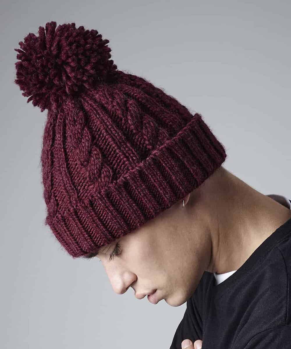 Embroidered Beechfield BC480 cable knit melange beanie with pom-pom, perfect for custom branding and.