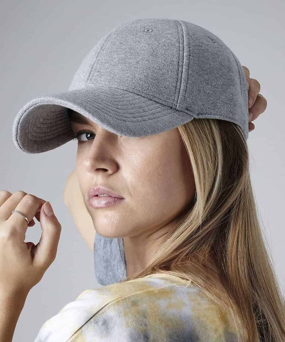 Embroidered grey baseball cap with curved brim, perfect for sports and casual wear. Customisable for.