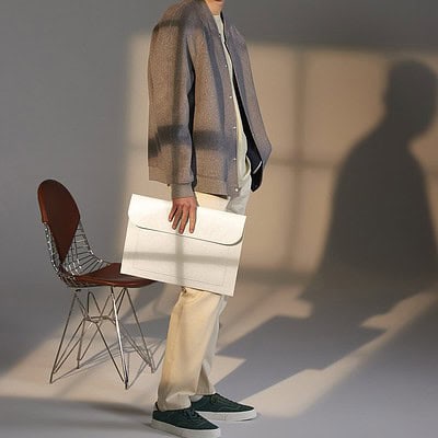 Laptop slip bag for embroidery and printing, made from felt material.