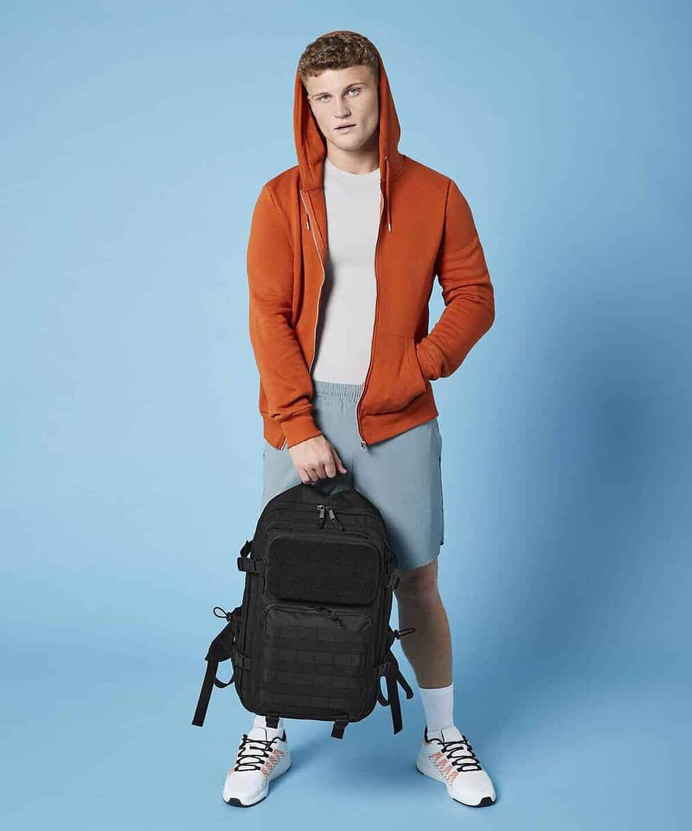 Black tactical backpack with molle webbing for outdoor and military use.