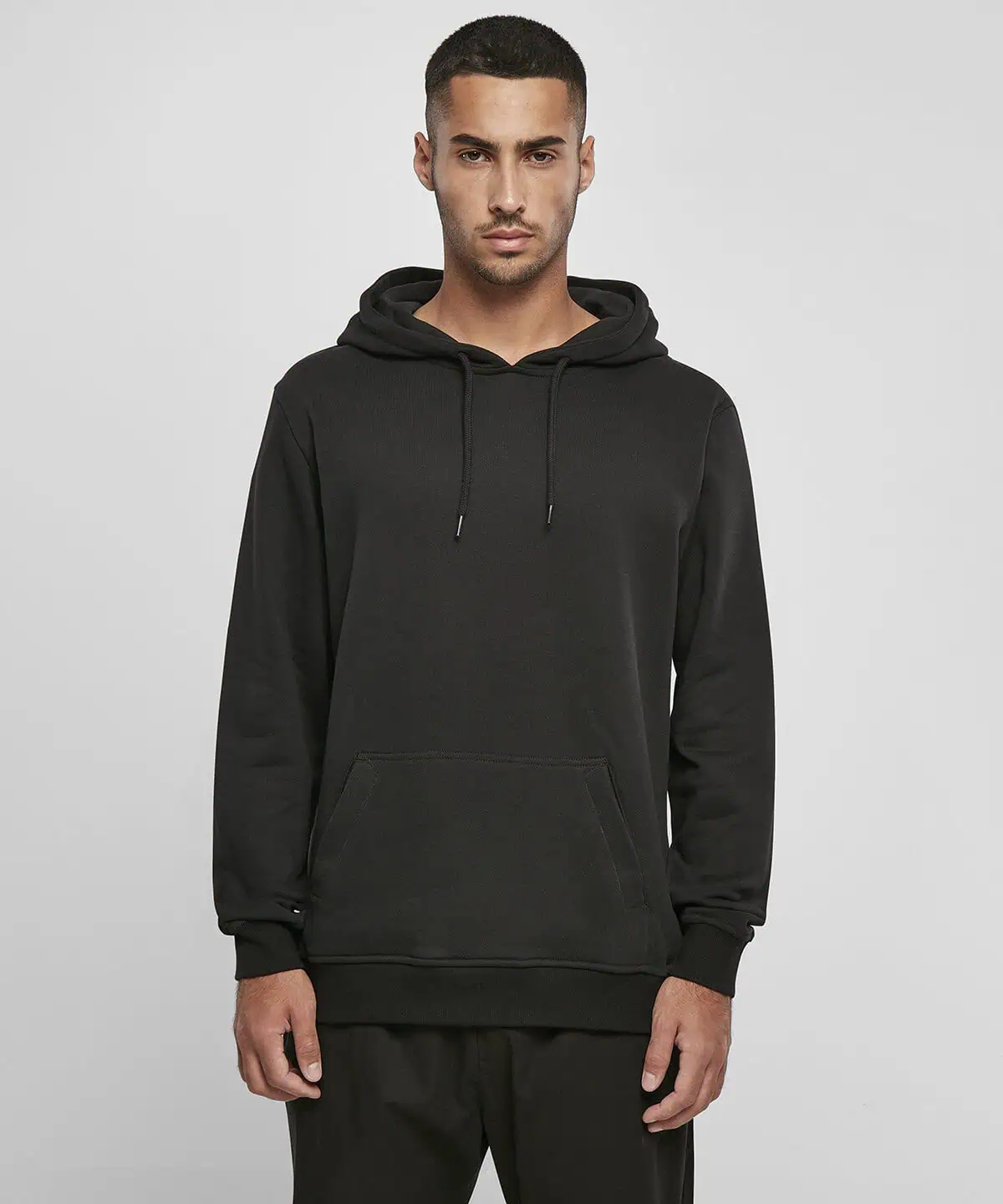 Black hoodie with drawstrings and kangaroo pocket, ideal for embroidered workwear and personalised uniforms, offering comfort and style for work or casual wear.