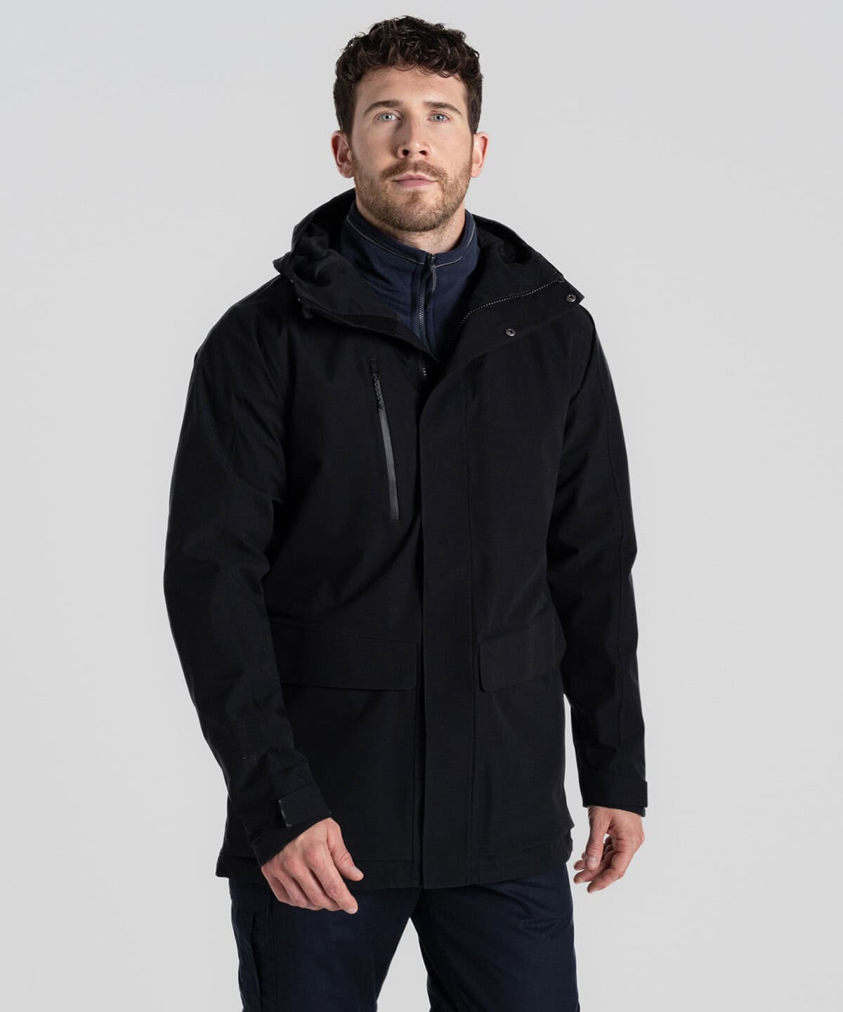 Men’s black waterproof technical jacket with embedded embroidery options for personalised workwear and corporate uniforms, ideal for outdoor work environments and professional appearance.