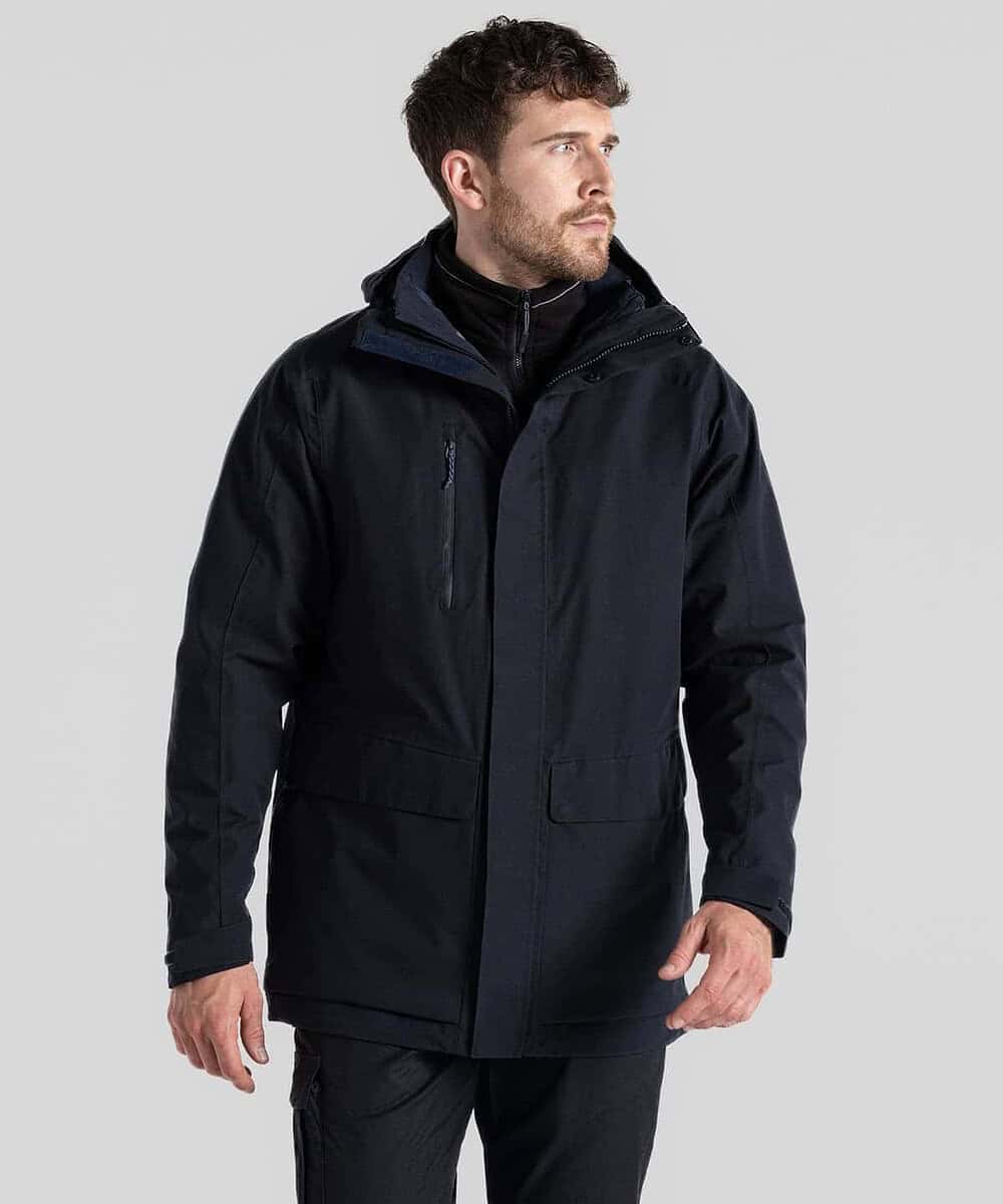 Man wearing a navy Craghoppers CR305 Kiwi Pro 3-in-1 jacket outdoors.