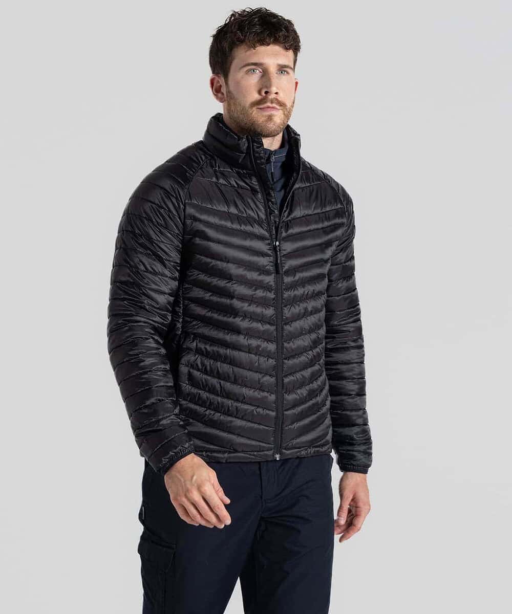 Man wearing a black puffer jacket suitable for work and outdoor activities.
