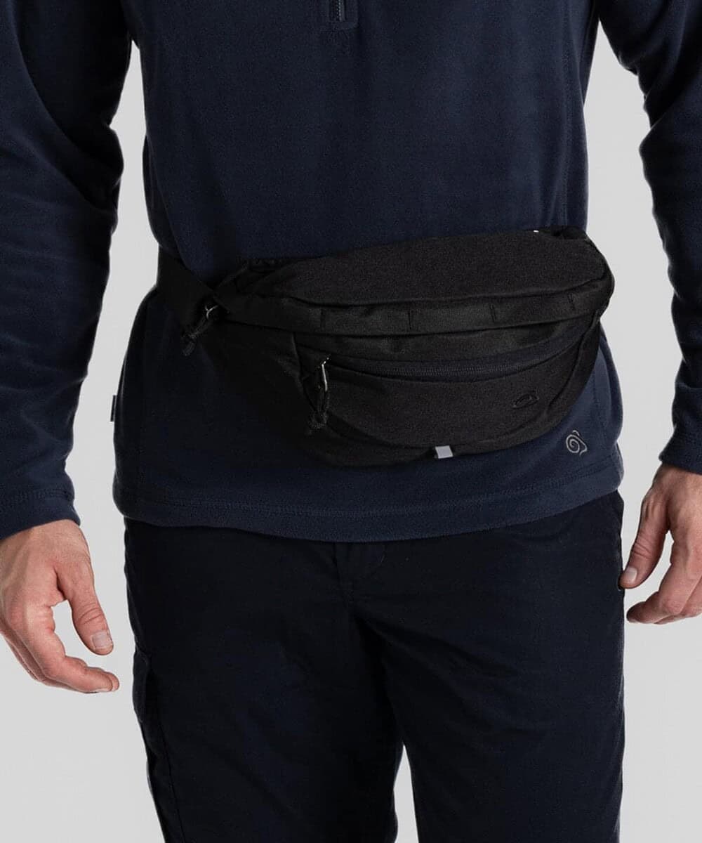 Waist pack with multiple compartments, ideal for outdoor work and travel.
