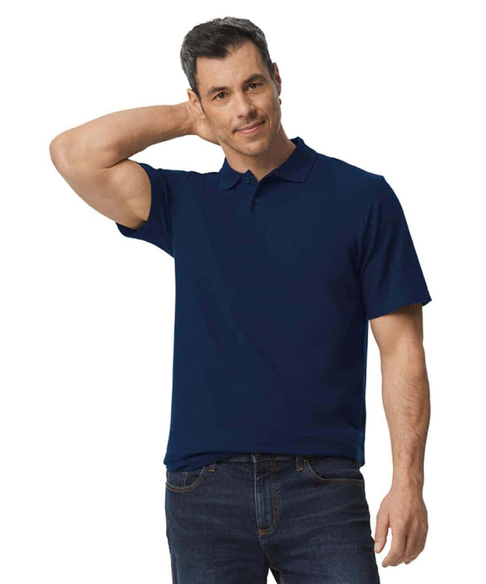 Man wearing navy blue Gildan GD017 softstyle polo shirt for embroidery.