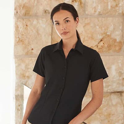 Black women's short sleeve work shirt with antibacterial and moisture-wicking features.