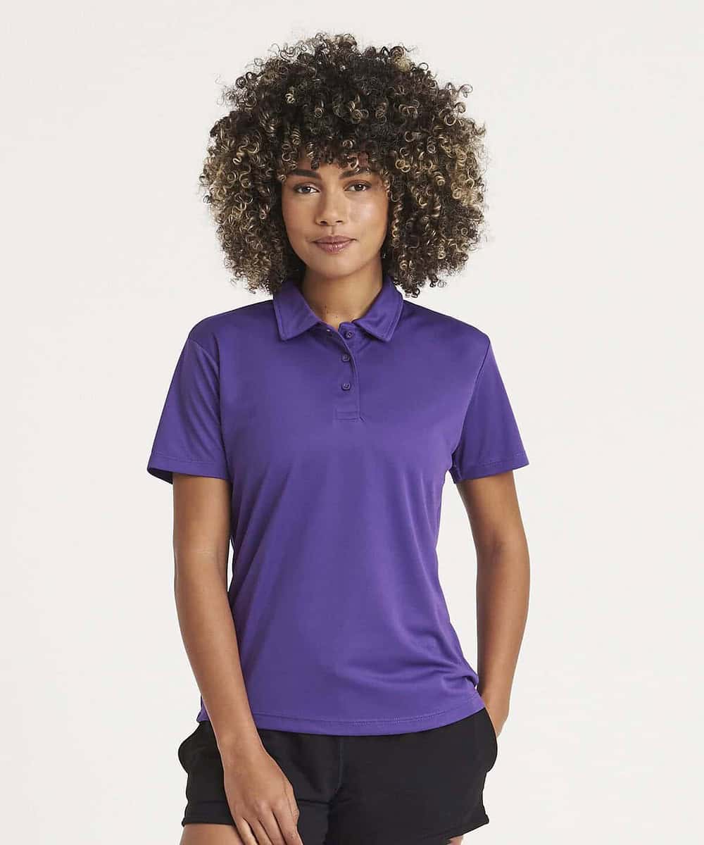 Woman wearing a purple embroidered polo shirt, suitable for workwear and casual settings.