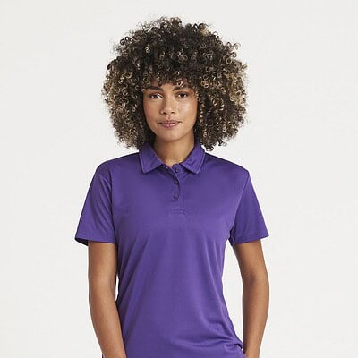 Woman wearing a purple embroidered polo shirt, suitable for workwear and casual settings.