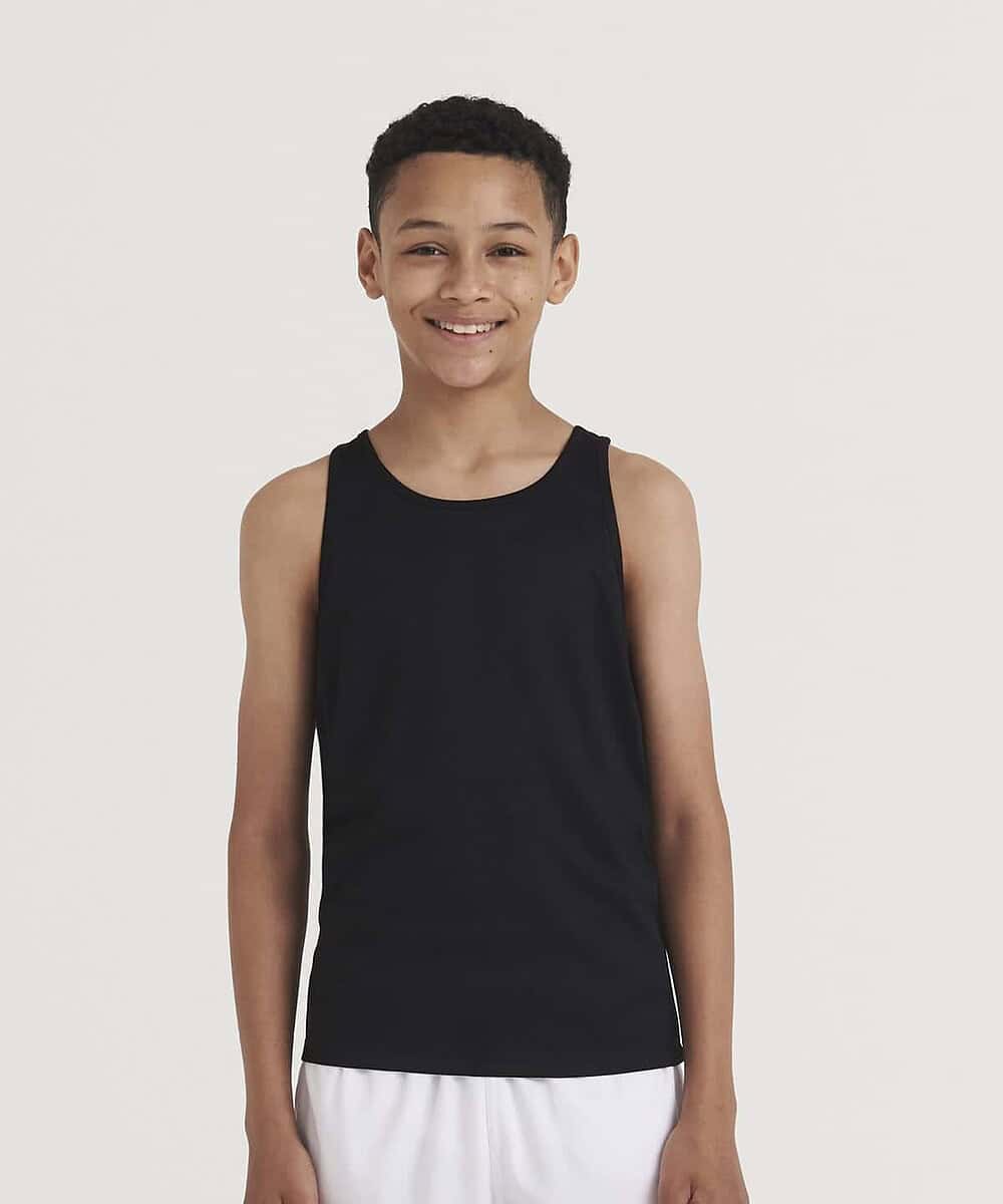 Child wearing black Awdis Cool Vest, ideal for kids' workwear and sports activities.