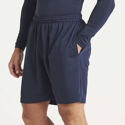 Man wearing navy blue athletic shorts and long-sleeve top, suitable for workwear.