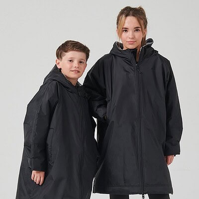 Children's waterproof hooded raincoat for outdoor wear.