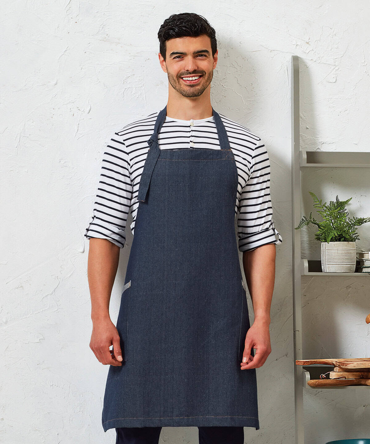 Striped casual men's shirt with navy apron, professional embroidery workwear for hospitality or catering industries, front pocket, adjustable neck strap, suitable for personalised uniforms.