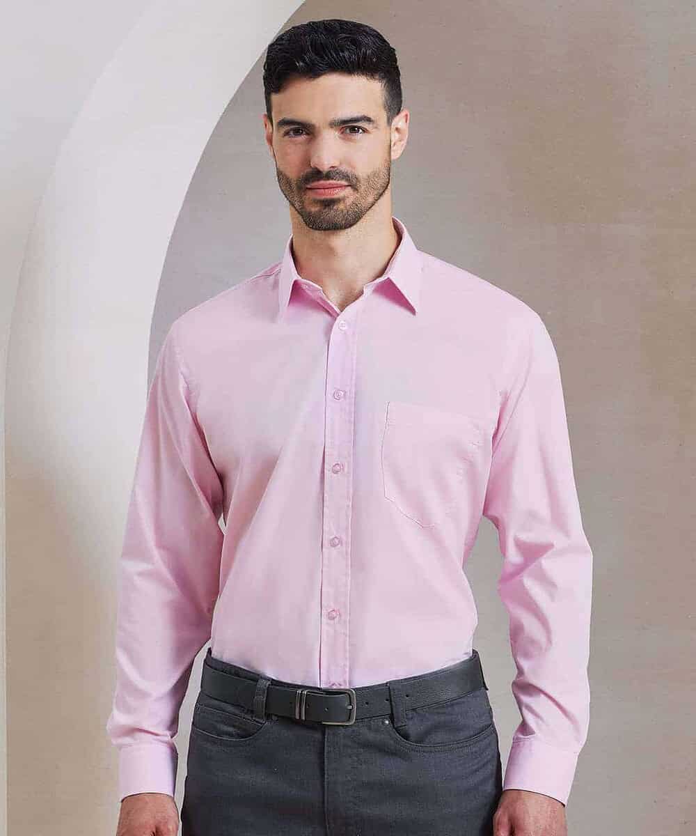 Man wearing a pink long sleeve poplin shirt for embroidery and printing.