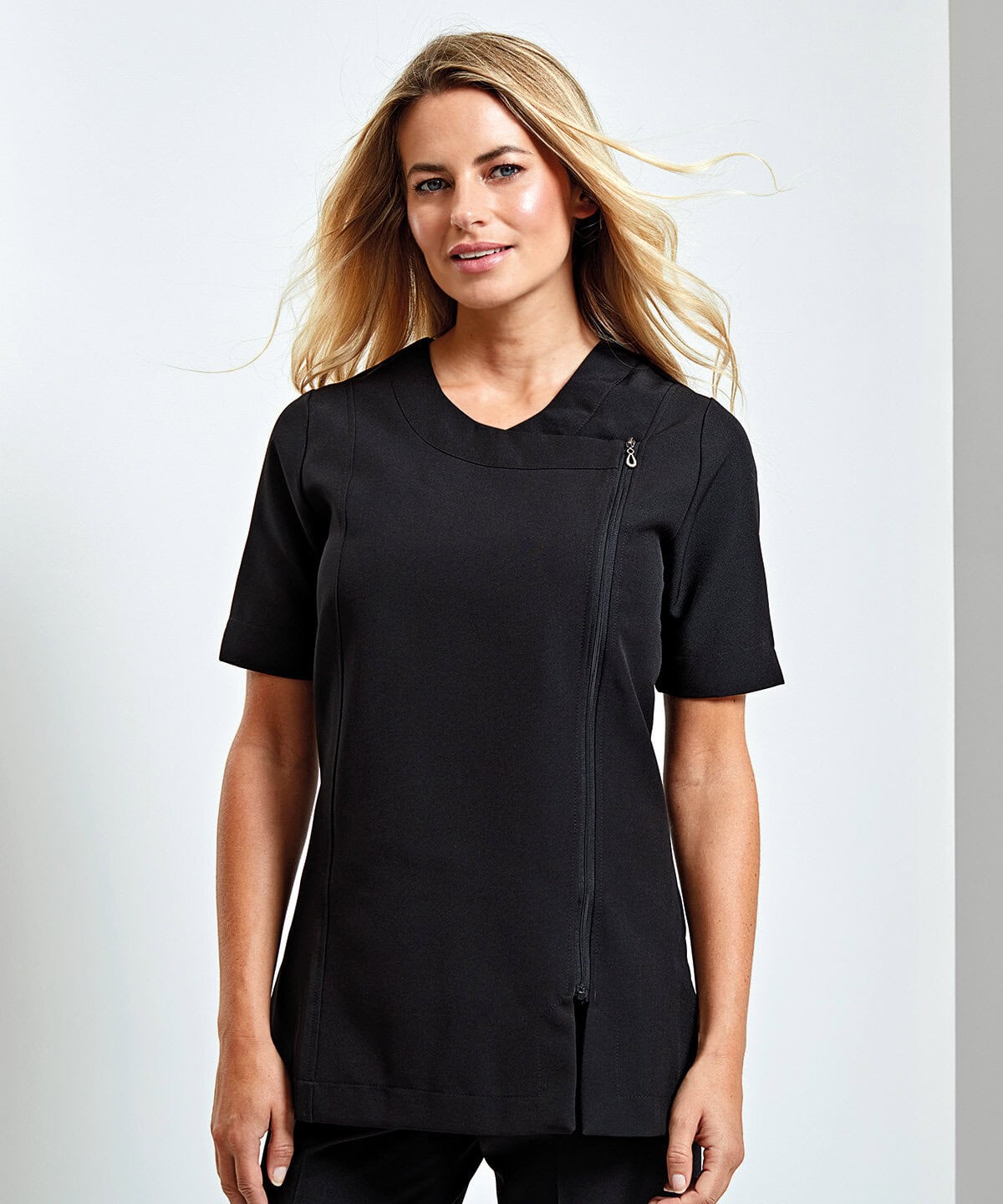 Bright professional black embroidered workwear tunic for customised uniforms, featuring a sleek design and functional zip closure. Ideal for uniforms in service industries with personalised embroidery options.
