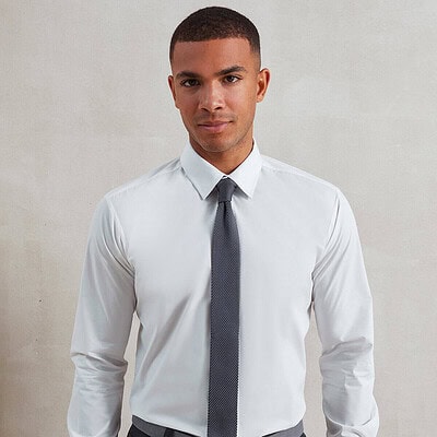 Elegant white shirt with slim tie, ideal for corporate or formal occasions.