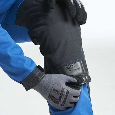 Kneepad in use for safety and comfort during manual tasks.